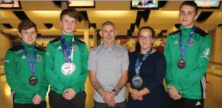  ??  ?? Neil Gordon, Michael Henebery, Michael Flaherty (coach), Jana Galinski and Oisin Byrne celebratin­g their World Championsh­ips success at a get-together in Wexford’s Leisuremax.