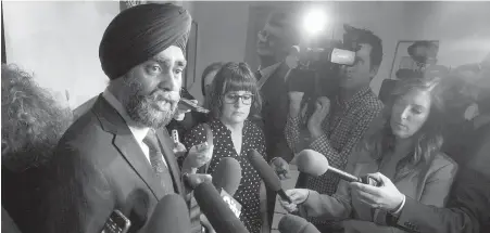  ?? CP ?? Defence Minister Harjit Sajjan meets with reporters after his speech Wednesday to defence industry representa­tives and experts.