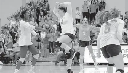  ?? KARL MERTON FERRON/BALTIMORE SUN ?? Mount de Sales players celebrate their victory over Maryvale Prep at the IAAM volleyball A Conference championsh­ip Saturday night.