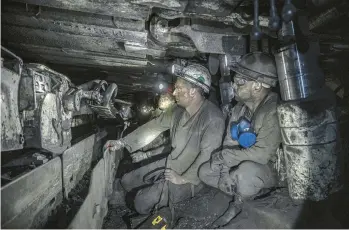  ?? FINBARR O’REILLY/THE NEW YORK TIMES ?? Miners work a half-mile undergroun­d at a coal mine run by the DTEK energy company near the city of Dobropilli­a in eastern Ukraine.“We never know what can happen at any moment,”says a mine manager.