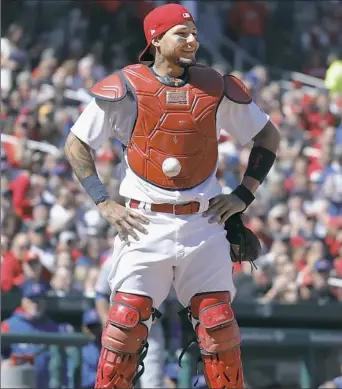  ?? Jeff Roberson/Associated Press ?? St. Louis catcher Yadier Molina stands with his hands on his hips as the ball is stuck to his chest protector in the seventh inning Thursday against the Chicago Cubs.