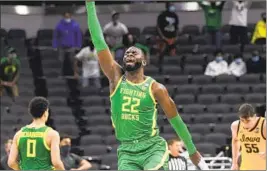  ?? Stacy Revere Getty Images ?? OREGON’S Frank Kepnang reacts to a score against Iowa in the second round.