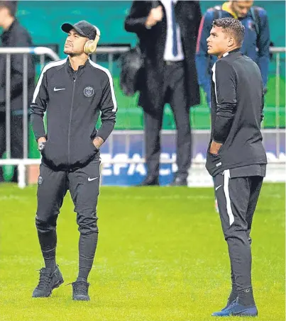  ??  ?? WATCHING BRIEF: PSG’s Neymar, left, and Thiago Silva before the French club’s press conference last night