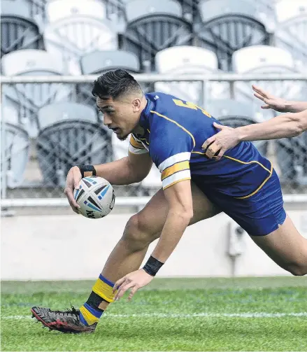  ??  ?? Try Time . . . Otago Whalers wing Willie Time brushes past West Coast’s Navare Jacobs to score in the corne Saturday.