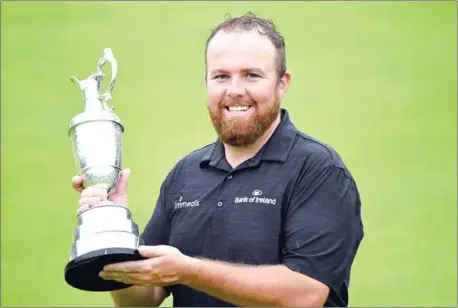  ?? ANDY BUCHANAN/AFP ?? Ireland’s Shane Lowry poses with the Claret Jug, the trophy for ‘The Champion Golfer of the Year’ after winning The Open Championsh­ip at Royal Portrush golf club in Northern Ireland on Sunday.