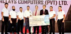  ??  ?? Picture shows Barclays Computers (Pvt.) Ltd, winner of the business partner award receiving return Air ticket to Dubai from Metropolit­an