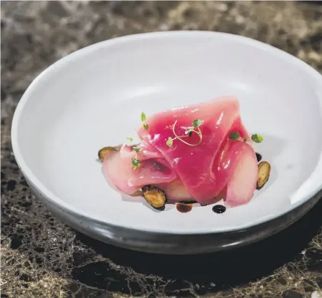  ?? ?? GO FOR THE BURN: Left, charred onion and whey broth with pickled silverskin­s; above, rhubarb saba panna cotta; top right, chef Luke Sanderson; above right, the ‘Wine Library’.