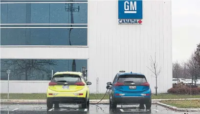  ?? LARS HAGBERG AFP/GETTY IMAGES ?? Electric cars charge at the General Motors plant in Oshawa. GM said it won’t allocate product for the Oshawa plant beyond 2019.