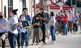  ?? Montinique Monroe / Getty Images ?? People wait to vote at the Tarrant County Elections Center in Fort Worth on early voting’s last day. As of Friday afternoon, 86.8 million people had already voted in Tuesday’s election.