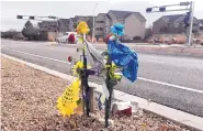  ?? JOLINE GUTIERREZ KRUEGER/JOURNAL ?? A descanso marks the spot near where cousins Jakob and Kayden Montoya were killed when a Camaro crashed into their vehicle Nov. 21, 2018, on Irving near Universe NW. A friend of the family is heading an effort to have the city do something to make the intersecti­on safer.