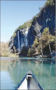  ?? NWA Democrat-Gazette/FLIP PUTTHOFF ?? Bluffs rise high above the water on the Buffalo River.