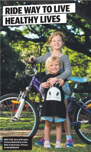  ?? Picture: EVAN MORGAN ?? BIKE FUN: Zara with sister Victoria Molachino at the Ride to Riverway.