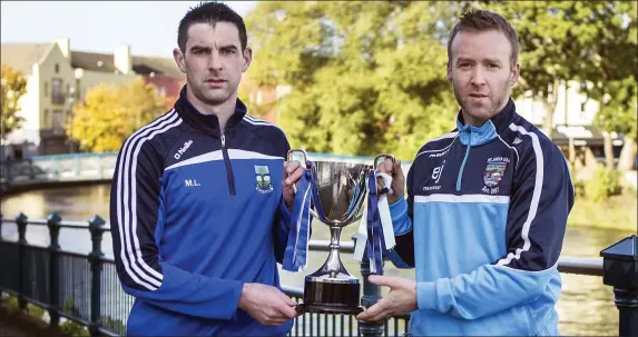  ??  ?? Matthew Lang, captain of St Farnan’s with Niall Walsh St John’s captain ahead of this Sunday’s Kennedys Intermedia­te final in Markievicz Park at 2pm. Pic: Donal Hackett.