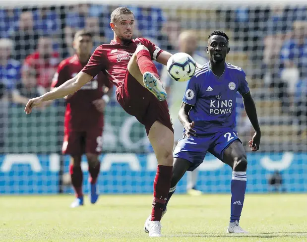  ?? — GETTY IMAGES ?? Liverpool midfielder Jordan Henderson controls the ball during a Premier League match with Leicester City on Saturday.