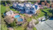  ?? ?? This 9,464-square-foot mansion (built in 2000) is located in Old Westbury on Long Island and is listed with Douglas Elliman’s Maggie Keats for $8 million.