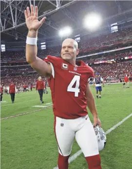  ?? ROB SCHUMACHER/AZCENTRAL SPORTS ?? Kicker Phil Dawson waves to cheering fans after Arizona defeated San Francisco 18-15 in overtime on Sunday at University of Phoenix Stadium in Glendale.