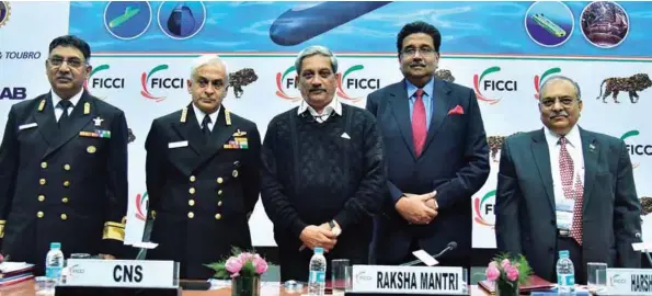  ??  ?? (L-R): Rear Admiral C.S. Rao; Chief of the Naval Staff Admiral Sunil Lanba; Defence Minister Manohar Parrikar; Harshavard­han Neotia; and Jayant D. Patil.