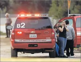  ?? Maria Alejandra Cardona Los Angeles Times ?? WORKERS found Jesse Hernandez about 5 a.m. Monday beneath a hatch along the 134 Freeway. Relatives had prayed in Griffith Park throughout the night.