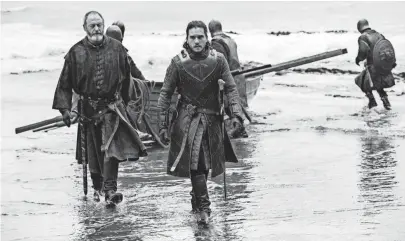  ??  ?? Davos (Liam Cunningham) and Jon (Kit Harington) arrive at Dragonston­e after a seemingly uneventful trip.