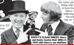  ?? ?? SOOTY’S CLEAN SWEEP: Harry and Sooty receive their OBEs in 1976 with Harry’s son Matthew