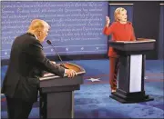  ?? Rick T. Wilking / Pool via AP ?? Republican presidenti­al nominee Donald Trump and Democratic presidenti­al nominee Hillary Clinton speak at the same time during Monday’s presidenti­al debate at Hofstra University in Hempstead, N.Y.