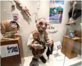  ?? ?? Hoggle, a puppet from the movie “Labyrinth,” is on display at the Unclaimed Baggage museum.