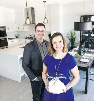  ?? CHRISTINA RYAN ?? Murray Danyluk, manager sales and marketing, and Emily Smith, marketing manager, of Stepper Homes, which took home three national awards, including the honour for Marketing Excellence.