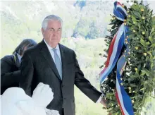  ?? RICCARDO DALLE LUCHE/THE ASSOCIATED PRESS ?? U.S. Secretary of State Rex Tillerson lays a wreath at a memorial in Santa’ Anna di Stazzema, Italy, where 560 civilians were killed by the Nazis.