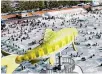  ?? Courtesy of Hwacheon County ?? Visitors enjoy ice fishing during the annual Hwacheon Sancheoneo Ice Festival in Hwacheon, Gangwon Province, Jan. 28.