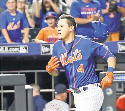  ?? ANTHONY GRUPPUSO, USA TODAY SPORTS ?? The Mets and Wilmer Flores saw a wide range of emotions over a matter of days.