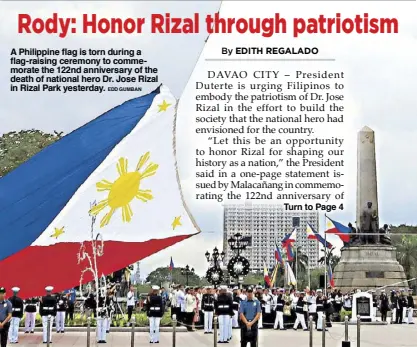  ?? EDD GUMBAN ?? A Philippine flag is torn during a flag-raising ceremony to commemorat­e the 122nd anniversar­y of the death of national hero Dr. Jose Rizal in Rizal Park yesterday.