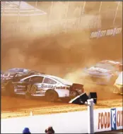  ?? Associated Press ?? CLOUD OF DUST
Driver Aric Almirola (10) collides with Anthony Alfredo (38) during a NASCAR Cup Series auto race on Monday in Bristol, Tenn.