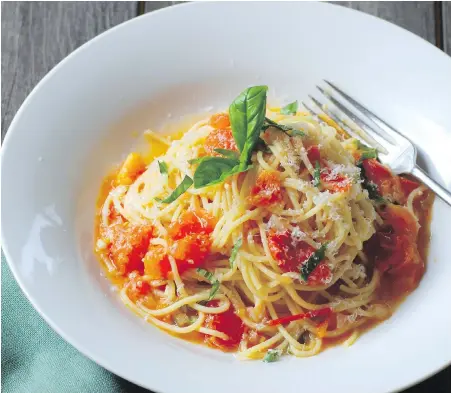  ??  ?? The Italian classic Spaghetti al Pomodoro is rich with garlic, tomatoes, basil and Parmesan cheese.