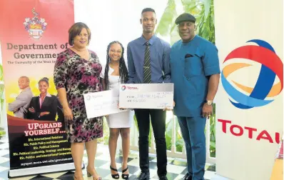  ?? CONTRIBUTE­D ?? From left: Dr Lisa Ann Vasciannie, head, Internatio­nal Relations Unit, Department of Government, University of the West Indies, Mona, smiles as Total Jamaica Bordeaux scholarshi­p recipients Anatassia Balfour and Shemar Findley show off their €6000 bursaries presented by Christophe­r Okonmah, managing director, Total Jamaica Limited.