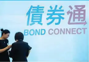  ?? BLOOMBERG PIC ?? The ‘Bond Connect’ programme allows internatio­nal investors to buy and sell in China’s historical­ly restricted interbank bond market through a Hong Kong trading gateway .