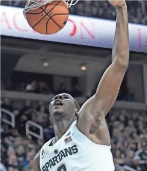  ??  ?? Michigan State's Jaren Jackson Jr. dunks during the first half on Feb. 20 at the Breslin Center in East Lansing. NICK KING/LANSING STATE JOURNAL