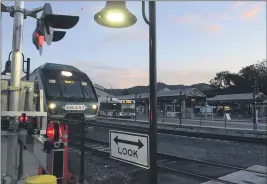  ?? SHERRY LAVARS — MARIN INDEPENDEN­T JOURNAL ?? A Larkspur-bound SMART train rolls past the San Rafael Transit Center in San Rafael earlier this year.