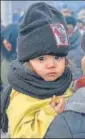  ?? AFP ?? ■
A child looks on as migrants wait at the Turkey-Greece border, in Pazarkule.