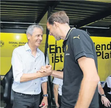  ?? FOTO: FIRO ?? Handschlag: Lucien Favre (li., damals Trainer von Borussia Mönchengla­dbach) und Thomas Tuchel (damals BVB).