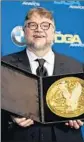  ?? Robyn Beck AFP / Getty Images ?? GUILLERMO del Toro with award for “Water.”