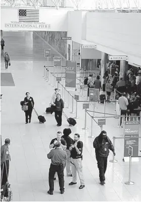  ?? KIM HAIRSTON/BALTIMORE SUN ?? BWI Concourse D in foreground and walkway to Concourse E, in background. The concourses are being connected as part of an effort to boost internatio­nal traffic.