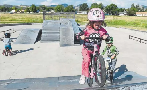  ?? Photos by AAron Ontiveroz, The Denver Post ?? Daisy Noyola, 3, practices earlier this month at Weaver Hollow Skate Park in Morrison ahead of Saturday’s Strider Cup World Championsh­ip in Boulder.