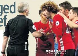  ??  ?? SEEING RED: Fellaini confronts ref Atkinson