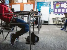  ?? Brett Coomer / Staff photograph­er ?? Students listen to the lesson in Cheryl Childs’ classroom on Oct. 27, 2020, at Aguirre Junior High in Channelvie­w ISD.