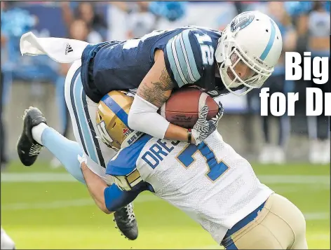  ?? THE CANADIAN PRESS ?? Not only did Weston Dressler have a solid game receiving on Saturday, he even made this nice tackle on Argos’ Mitchell White after a Matt Nichols intercepti­on.