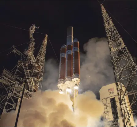  ?? NASA VIA GETTY IMAGES ?? NASA’s Parker Solar Probe lifts off from Cape Canaveral, Fla., on Sunday. It is named for Eugene Parker, 91, who predicted the makeup of the solar wind as supercharg­ed particles and its extreme temperatur­es, which are for some reason hotter than the surface of the sun.