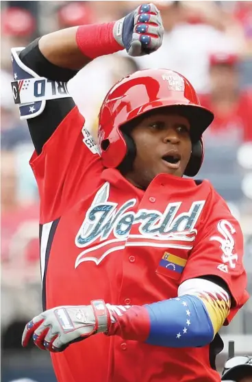  ?? ROB CARR/GETTY IMAGES ?? White Sox prospect Luis Basabe, 21, ripped a 102 mph fastball from Hunter Greene for a home run.