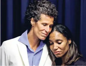  ??  ?? Bill Cosby accuser Andrea Constand (left) embraces prosecutor Kristen Feden during a news conference after Cosby was found guilty in his sexual assault retrial yesterday in Norristown, Pennsylvan­ia.