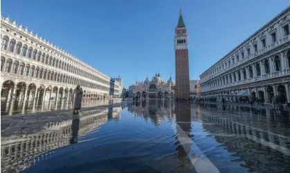  ?? Photograph: Stefano Mazzola/Getty Images ?? St Mark’s Square in Venice flooded at high tide. The population of the city is dwindling.