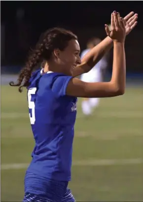  ?? PETE BANNAN — DIGITAL FIRST MEDIA ?? Great Valley’s Jenny Osinski applauds her team’s victory in Tuesday’s playoff game against Ridley.